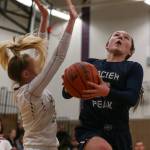 Glacier Peaks Maya Erling (right) attempts a shot with Lake Stevens Chloe Pattison defending during the Grizzlies 67-48 win over the Vikings on Tuesday night at Lake Stevens High School. (Kevin Clark / The Herald)