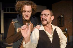 Bobby (Trey McGee) and Teach (Michael McFadden) contemplate the inflated value of a rare coin in Red Curtains production of American Buffalo, through Feb. 3 in Marysville. (Larry T. Lisk)