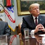 President Donald Trump (right) listens during a health care roundtable in the Roosevelt Room of the White House on Wednesday in Washington. (AP Photo/Jacquelyn Martin)