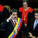Venezuelan President Nicolas Maduro salutes as he arrives to the Supreme Court for an annual ceremony that marks the start of the judicial year in Caracas, Venezuela, on Thursday. (AP Photo/Ariana Cubillos)