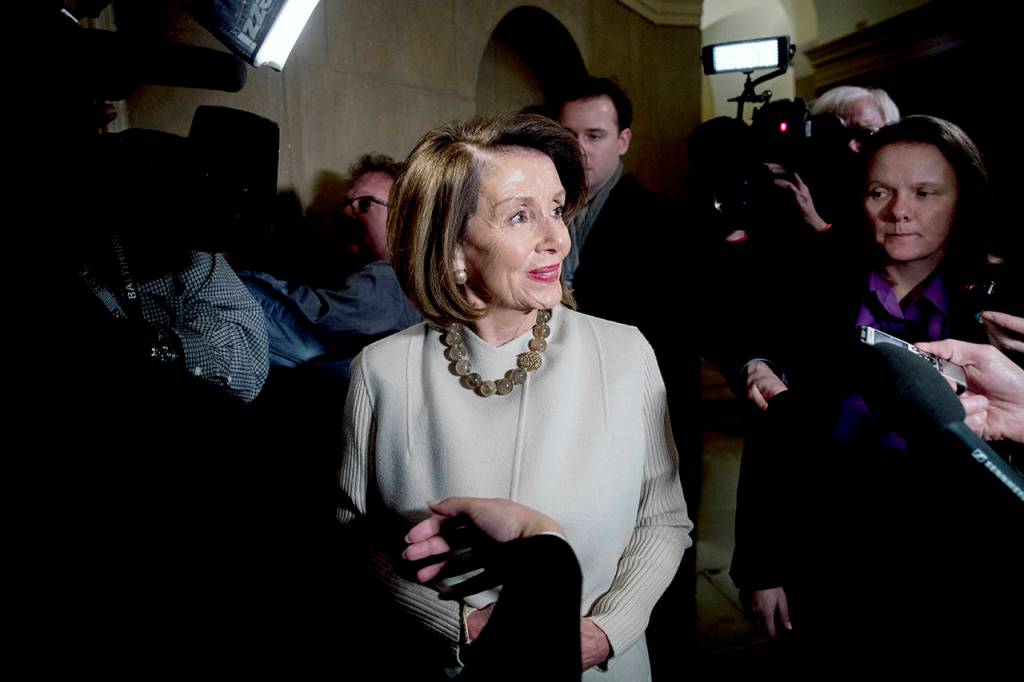 House Speaker Nancy Pelosi speaks to members of the media as she arrives on Capitol Hill in Washington on Friday. (AP Photo/Andrew Harnik)