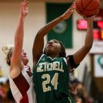 Marysville Getchells Kiarra Green attempts a shot with Marysville Pilchucks MacKenzie Konsor (left) defending at Marysville Pilchuck High School on Friday. The Chargers won 62-15. (Kevin Clark / The Herald)