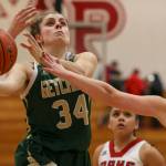 Marysville Getchells Maddy Grandbois attempts a shot with Marysville Pilchucks MacKenzie Konsor (right) reaching in at Marysville Pilchuck High School on Friday. The Chargers won 62-15. (Kevin Clark / The Herald)