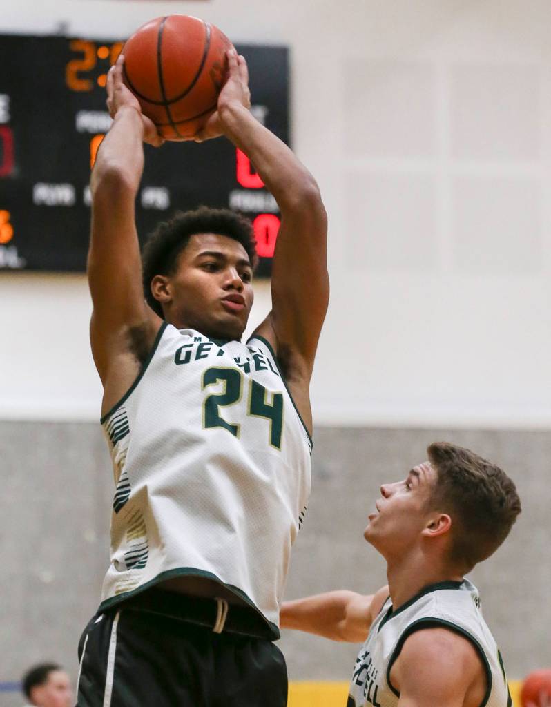 Malakhi Knight controls the ball as Dylan Rice defends during practice at Marysville Getchell High School on Jan. 16. (Kevin Clark / The Herald)