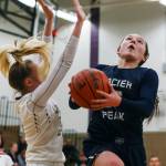 Glacier Peaks Maya Erling (right) attempts a shot with Lake Stevens Chloe Pattison defending at Lake Stevens High School on Jan. 22. Glacier Peak won 67-48. (Kevin Clark / The Herald)