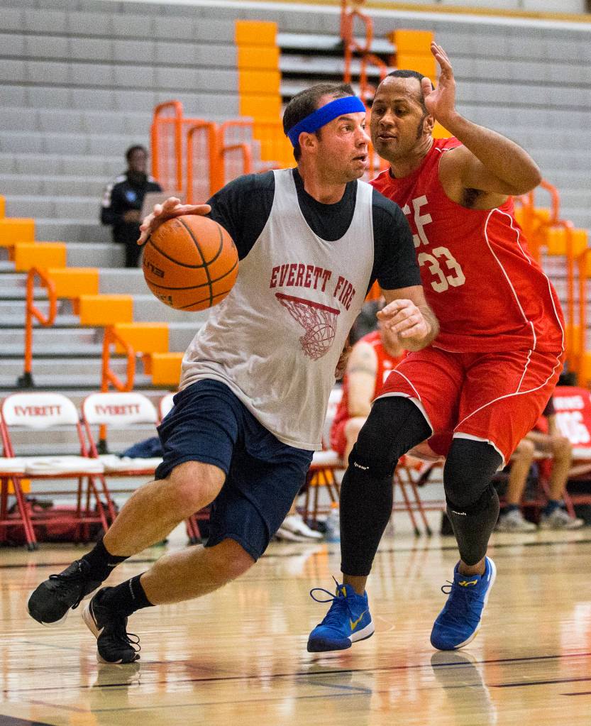 Everett Fires Chris Stepanski drives to the hoop during the charity game on Jan. 19 in Everett. (Olivia Vanni / The Herald)