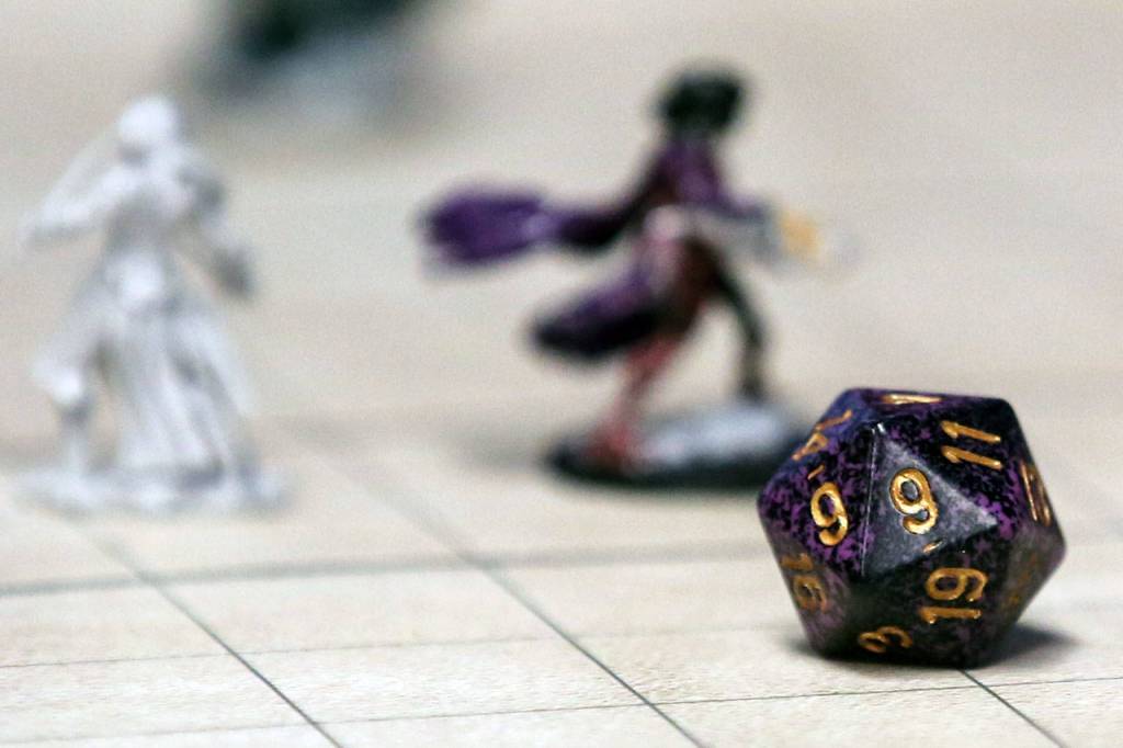Dungeons & Dragons game pieces help illustrate a largely imaginary activity Jan. 26 at Geek Fortress in Snohomish. (Kevin Clark / The Herald)