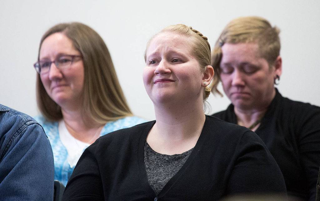 The sisters of Miriam Kay Robinson react at the Snohomish County Courthouse on Wednesday in Everett as Aaron Gentry is sentenced for the vehicular homicide of Miriam Kay Robinson. (Andy Bronson / The Herald)