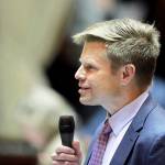 Sen. Jamie Pedersen, D-Seattle, speaks on the Senate floor in Olympia on Wednesday. Pedersen introduced a bill that he says moves the Legislature toward more transparency  but within limits. (AP Photo/Ted S. Warren)