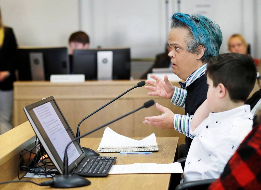 Peter Reckendorf (left), of Everett, testifies Thursday before the Senate Law and Justice Committee of the Legislature in favor of a proposed statewide ban on risky entertainment events, including dwarf tossing, that feature people with dwarfism. (AP Photo/Ted S. Warren)