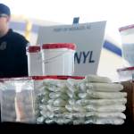 A display of the fentanyl and meth that was seized by Customs and Border Protection officers over the weekend at the Nogales Port of Entry is shown during a press conference Thursday in Nogales, Arizona. U.S. Customs and Border Protection officials captured nearly 254 pounds (114 kilograms) of the deadly synthetic opioid fentanyl from a secret compartment inside a load of Mexican produce heading into Arizona. (Mamta Popat/Arizona Daily Star via AP)