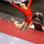 USAs Katelyn Ohashi jumps above the beam March 16, 2012, during the Pacific Rim Gymnastics Championships Womens Finals at Xfinity Arena in Everett. (Jennifer Buchanan / The Herald)