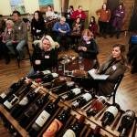 Guests listen to food-industry experts at a recent event at the Double Barrel Wine Bar in Snohomish. (Andy Bronson / The Herald)