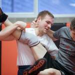 Archbishop Murphy senior wrestler Devin Moore takes down teammate Colin Howell during practice Monday, Jan. 21, in Everett. (Andy Bronson / The Herald)
