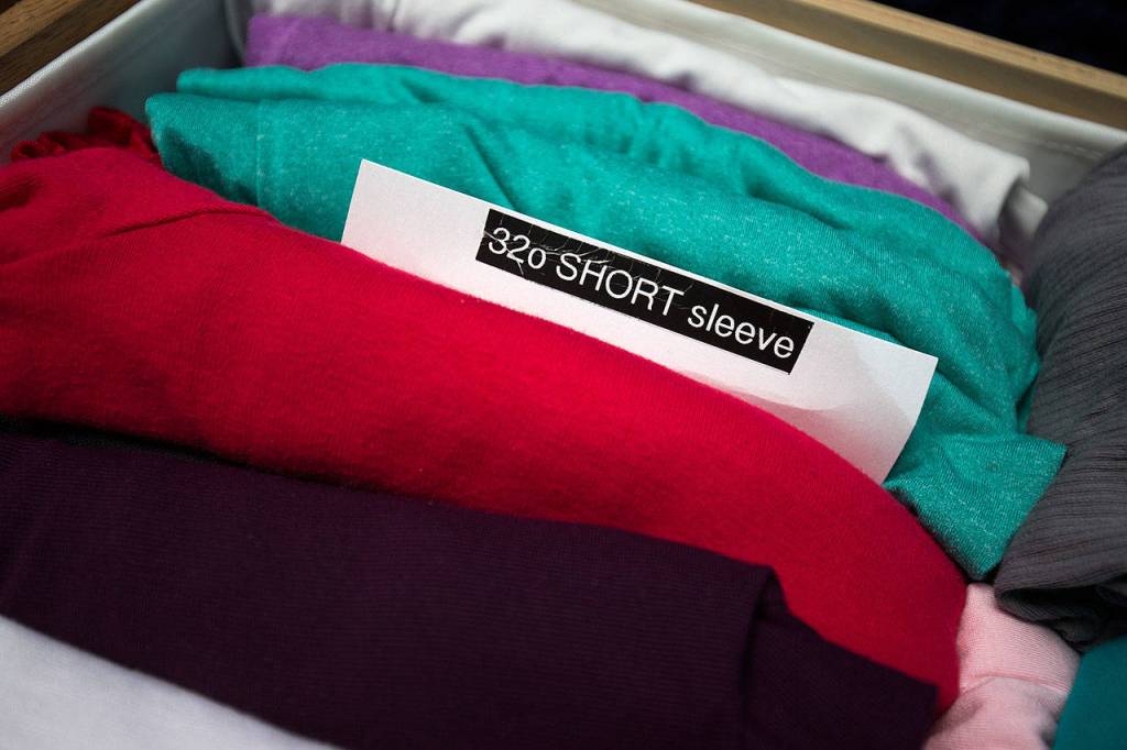 Jackie Noble,72, has organized her dresser clothes using the Marie Kondo method, to the point of labeling the items. (Andy Bronson / The Herald)