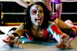 Thunder Rosa, bottom, and Priscilla Kelly in the ring at a monthly independent wrestling match at Normanna Lodge by Everett promoter Without a Cause. (Vitz Photos)