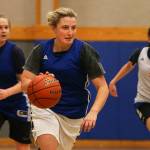 Grace Academy senior Ashley VanDam (center) leads a fast break during practice on Jan. 30 in Marysville. (Kevin Clark / The Herald)