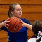 Grace Academy freshman Heidi Impola looks to pass during practice on Jan. 30 in Marysville. (Kevin Clark / The Herald)