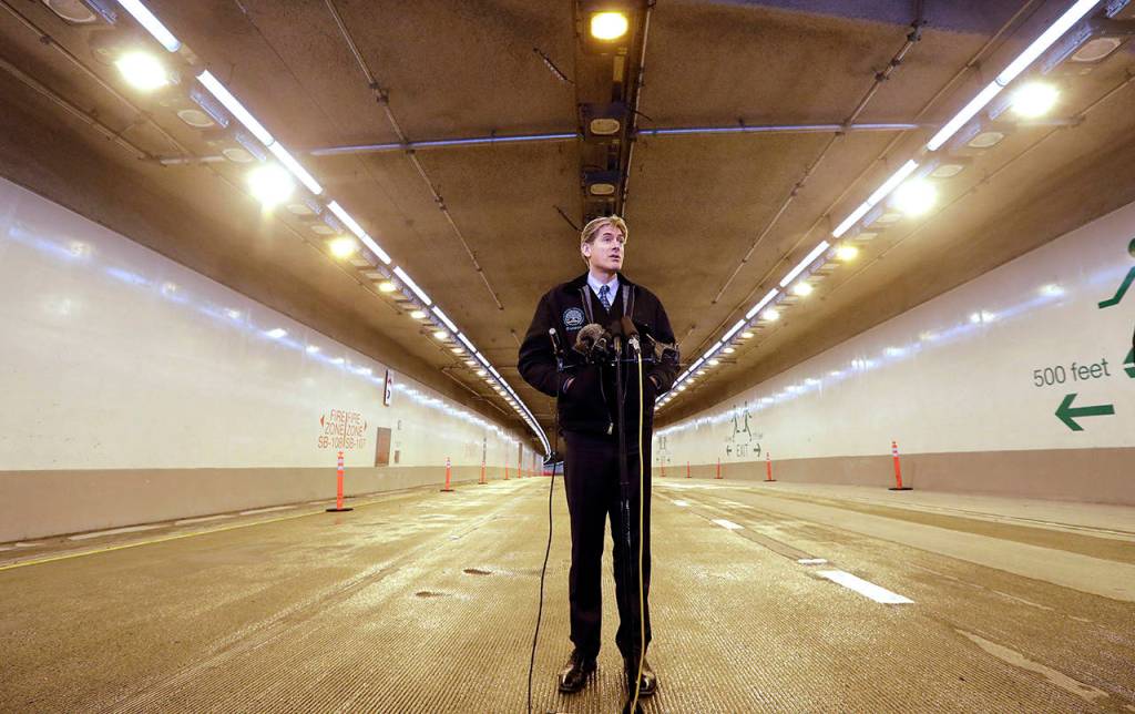 David Sowers, Alaskan Way Viaduct Replacement Program Deputy Administrator, stands inside the new State Route 99 tunnel Friday as he speaks with media members in Seattle. (AP Photo/Elaine Thompson)