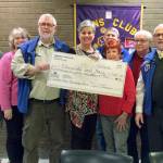 Edmonds Lions Club donated $5482.42 on Jan. 21 to the Edmonds Food Bank Executive Director Casey Davis. (Submitted photo)