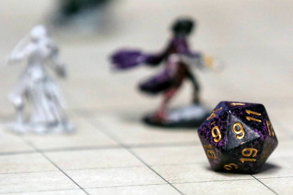 Dungeons and Dragons game pieces are seen at <a href="https://www.heraldnet.com/life/swords-and-sorcery-in-snohomish-from-the-minds-of-children/" target="_blank">Geek Fortress</a> in Snohomish on Jan. 26. (Kevin Clark / The Herald)