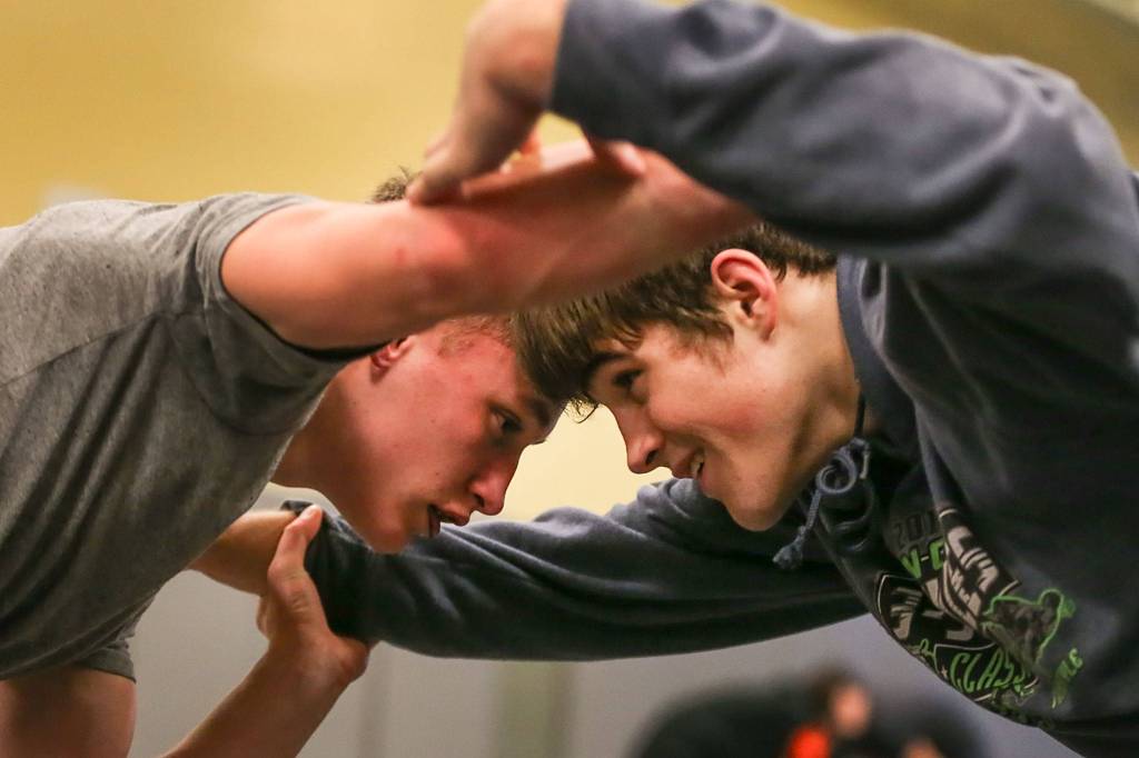 Kolby Petraborg (left) and Hayden Long wrestle at Granite Falls High on Jan. 31. (Kevin Clark / The Herald)
