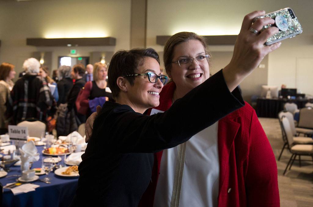Everett Mayor Cassie Franklin (left) takes a self with Shelly Ganje after delivering the State of the City speech at Angel of the Winds Arena on Jan. 31 in Everett. (Andy Bronson / The Herald)