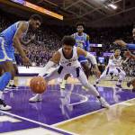 Washington guard Matisse Thybulle (center) drives between UCLA forward Cody Riley (left) and guard Jaylen Hands after making a steal during a game on Feb. 2, 2019, in Seattle. (AP Photo/Ted S. Warren)