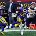New England Patriots tight end Rob Gronkowski (87) catches a pass in front of Los Angeles cornerback Marcus Peters (22) and linebacker Cory Littleton (58) during the second half Sundays Super Bowl in Atlanta. (AP Photo/David J. Phillip)