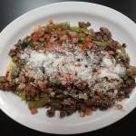 One of Tía Letys bestsellers is the huarache. Its made with a corn dough base, fried in an oblong shape and topped with smashed pinto beans, queso fresco and a variety of other toppings. The dish gets its Spanish name from its sandal-like shape. (Sara Bruestle / The Herald)