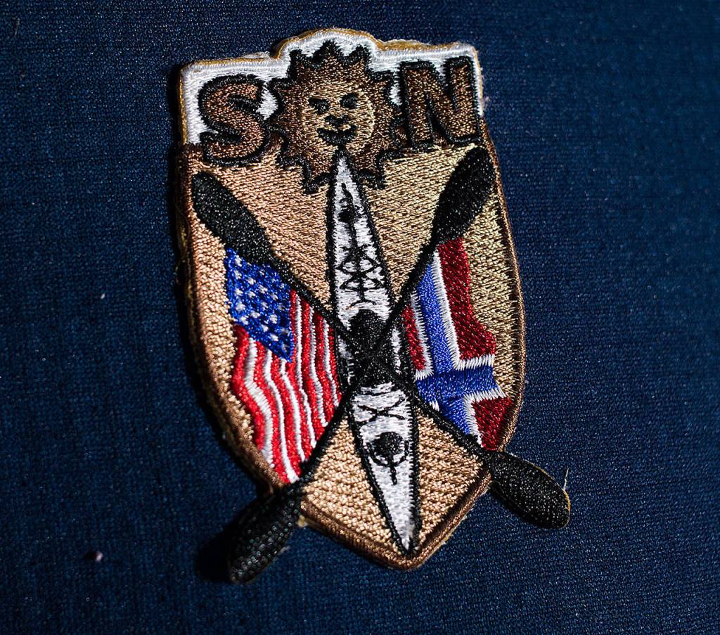 Dave Ellingson sports a patch on his jacket commemorating his month-long paddle trip in Norway. (Andy Bronson / The Herald)
