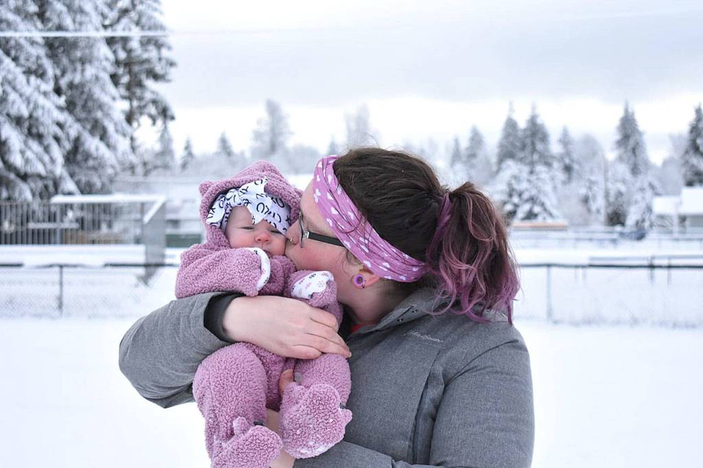 Mother and daughter Madison and Raelin Franchi are in matching purple for babys first snow in Granite Falls. Raelin is just 3 months old. (Susan Fraley)