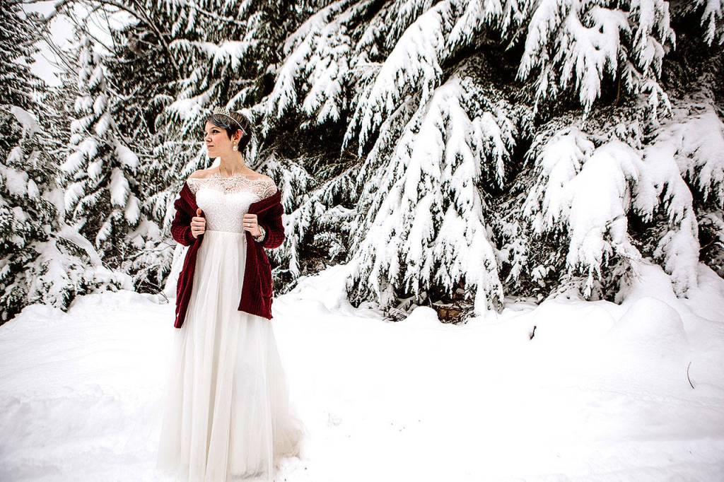Cian Cheetham poses as a bride to inspire couples to have a winter wedding at the Lookout Lodge in Snohomish. Her mom is the wedding photographer and her friend owns the lodge. (Kate Gansneder)