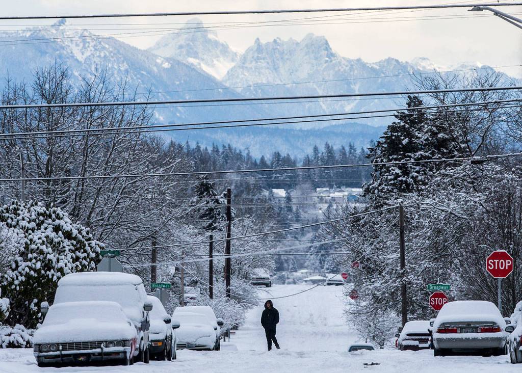 A pedestrian crosses 17th Street on Saturday in Everett. (Olivia Vanni / The Herald)