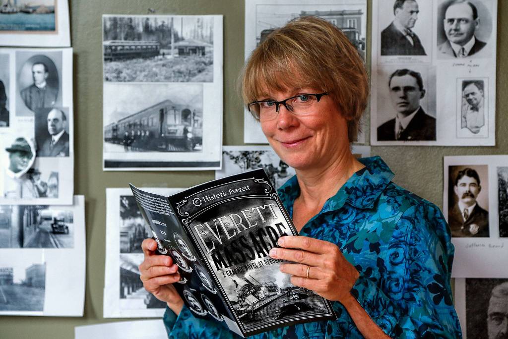 Inside Deb Foxs finished graphic novel, lying atop a storyboard-sketchbook in the artists home studio, shadowy charcoal characters come alive with words, sprouting circles of dialogue from a 100-year-old conflict. (Dan Bates / The Herald)