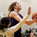 North Creeks Caitlin Monten attempts a shot with Jacksons Jaelen Williams defending during a 4A Wes-King District Tournament play-in game Thursday at Jackson High School in Mill Creek. North Creek beat the Timberwolves 84-70. (Kevin Clark / The Herald)