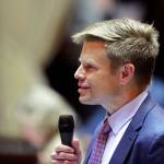 State Sen. Jamie Pedersen, D-Seattle, speaks on the Senate floor in Olympia, Jan. 30. Pedersen introduced a bill Jan. 31 that he says moves the Legislature toward more transparency  but within limits. The move comes a year after Washington lawmakers tried to exempt themselves from the states Public Records Act following a lawsuit filed by a media coalition, led by The Associated Press, who asserted lawmakers were violating the law by not releasing emails, schedules and reports of sexual harassment. (Ted S. Warren/Associated Press)
