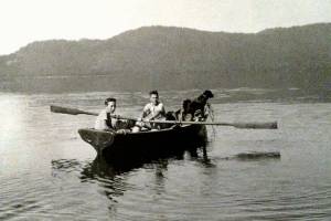 Richard Ahrens, Julie Muhlsteins 96-year-old father, is holding the oars in this photo taken at Priest Lake, Idaho, during his boyhood. Along with a dog, Ahrens second cousin, Norman Cross, is in the boat. (Ahrens family photo)