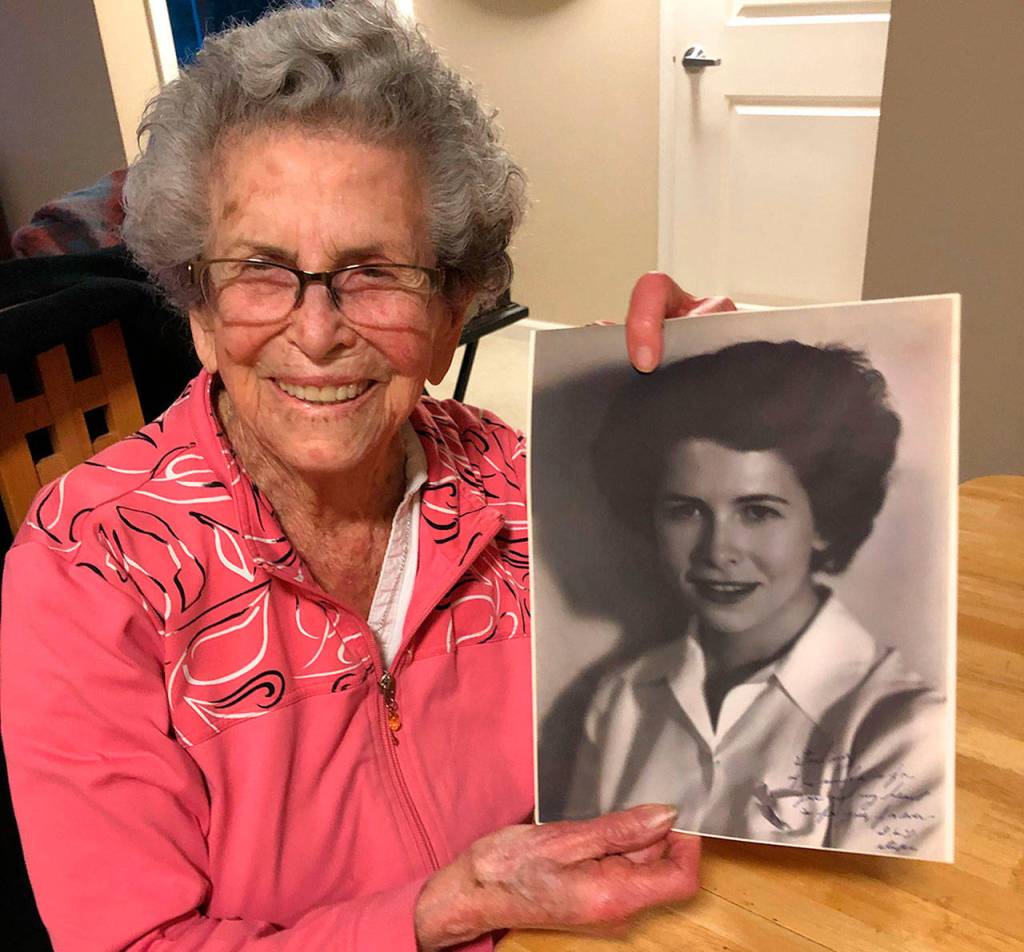 Meredythe Glass poses with one of her headshots from her days working in Hollywood in the late 1930s. (Greg Asimakoupoulos)
