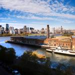 In this Nov. 2018 photo, a rusting ferryboat is docked next to an aging industrial warehouse on Long Island Citys Anable Basin in the Queens borough of New York. Amazon said Thursday that it is dropping New York City as one of its new headquarter locations. (AP Photo/Mark Lennihan, File)