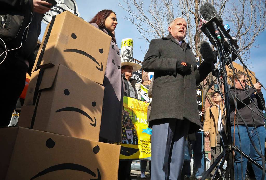 New York City Councilman Jimmy Van Bramer (center) speaks during a news conference Thursday in Gordon Triangle Park in the Queens borough of New York, following Amazons announcement it would abandon its proposed headquarters for the area. (AP Photo/Bebeto Matthews)