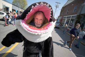 Howard Garrett, co-founder of the Orca Network on Whidbey Island, wears a killer whale costume at the Welcome the Whales Parade in Langley in 2015. (David Welton of davidweltonphoto.com)