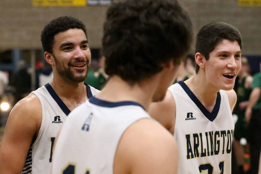 Arlington is all smiles after beating Marysville Getchell to clinch a state regional berth and advance to the district title game. (Kevin Clark / The Herald)