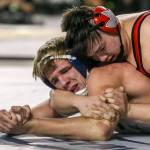 Sultans Tyler Deason (left) struggles against Grangers Gage Cook in the 220 weight class Saturday night during the Mat Classic XXXI at the Tacoma Dome on February 15, 2019 in Tacoma. Deason finished second in state. (Kevin Clark / The Herald)