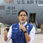 Lester Toledo from the Coalition Aid and Freedom Venezuela speaks in front of a C-17 cargo plane loaded with humanitarian commodities at Homestead Air Reserve Base on Saturday in Homestead, Florida. (AP Photo/Luis M. Alvarez)