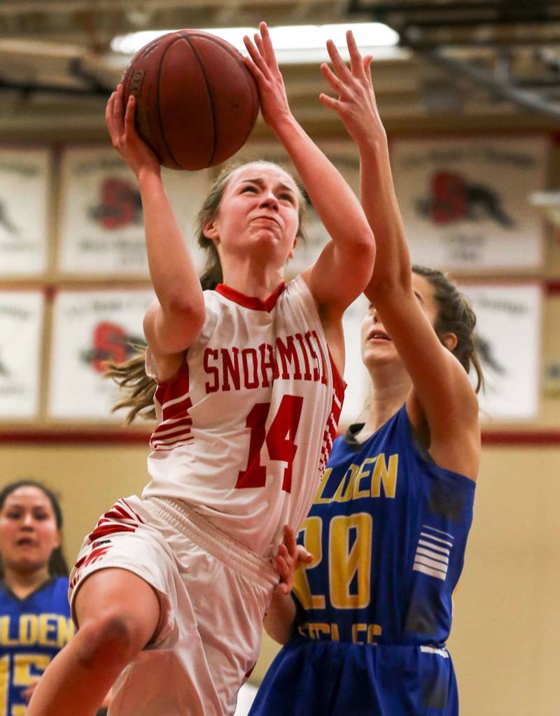 Snohomishs Maya DuChesne attempts a layup with Ferndales Nicole Guessford defending at Snohomish High School in on Feb. 13. The Panthers won 47-34. (Kevin Clark / The Herald)