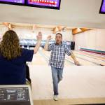 <a href="https://www.heraldnet.com/news/strike-after-strike-a-night-to-remember-at-glacier-lanes/" target="_blank">Christie Aquilar high fives Tony Cea</a> after bowling a strike at Glacier Lanes on Jan. 28 in Everett. (Andy Bronson / The Herald)