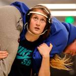 Cassidy OHara carries Olivia Poulton during conditioning drills at Lakewood High School in Arlington on Feb. 6. (Kevin Clark / The Herald)
