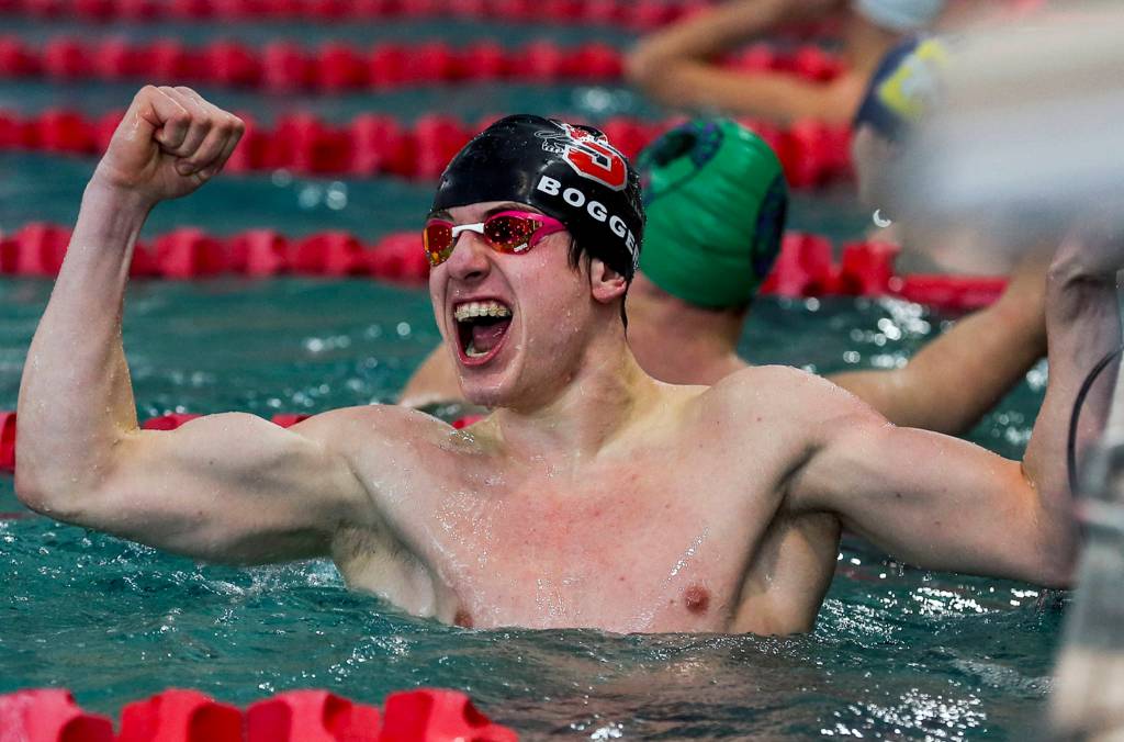 Snohomishs James Boggeri celebrates his first place in the Boys 50-yard freestyle during the NW District 1 3A Boys Swim and Dive at the Snohomish Aquatic Center on Feb. 8. The Jaguars won 84-70. (Kevin Clark / The Herald)