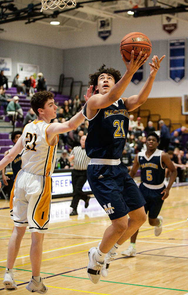 Mariners Tony MacArthur goes up for a layup Monday, Feb. 18, in a district boys basketball game at North Creek High in Bothell. (Andy Bronson / The Herald)